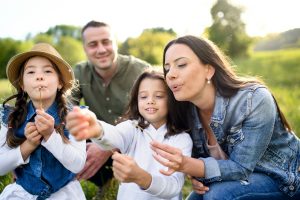 family dandelions unsplash getty